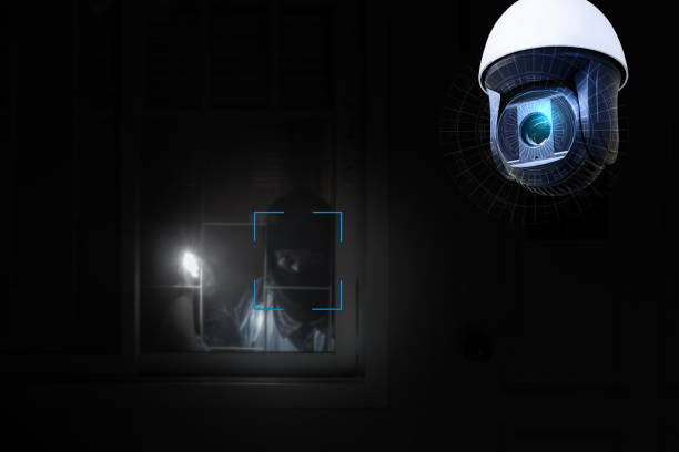 istock Thief use crowbar break into a house at window being caught by CCTV, surveillance camera. 2162957012