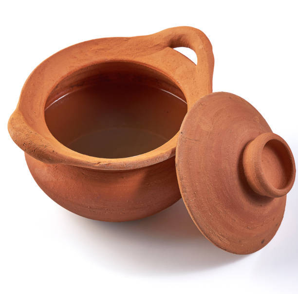 istock Clay pot (earthenware pot) with opened lid isolated on white background. Pottery is the process of making containers out of clay and burning. Vintage, Retro and Antique Kitchenware. 2162957627