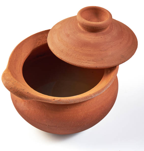 istock Clay pot (earthenware pot) with opened lid isolated on white background. Pottery is the process of making containers out of clay and burning. Vintage, Retro and Antique Kitchenware. 2162957629