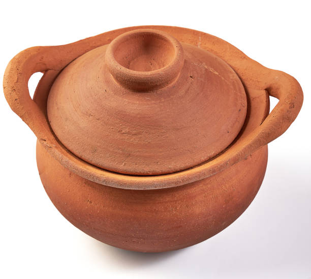 istock Clay pot (earthenware pot) with lid isolated on white background. Pottery is the process of making containers out of clay and burning. Vintage, Retro and Antique Kitchenware. 2162957650