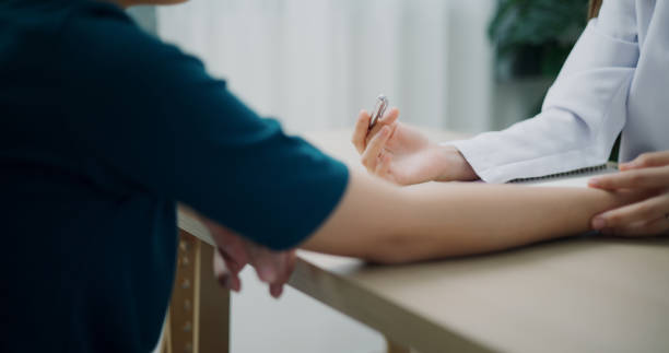 istock Close-up of a doctor's hand explaining to a patient. 2162958852