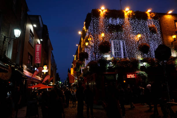 Dublin, Ireland-July 1, 2019: views of neighborhoods of historic Dublin with pubs in the entertainment district at dusk. Temple Bar Lane is promoted as Dublin's 'cultural quarter.\