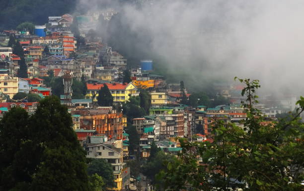 istock clouds are floating over beautiful darjeeling hill station in monsoon season, panoramic view of townscape and himalaya mountain foothills, india 2162963940