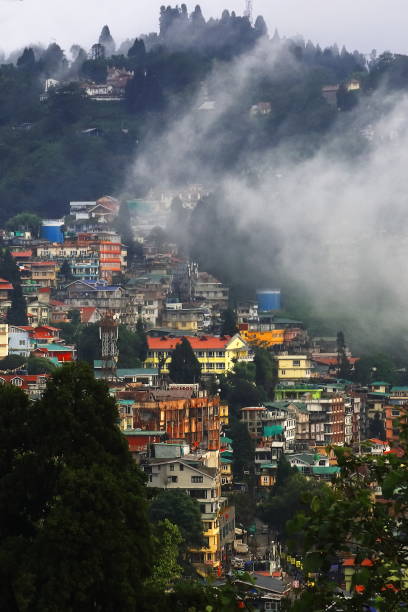 istock clouds are floating over beautiful darjeeling hill station in monsoon season, panoramic view of townscape and himalaya mountain foothills, india 2162964015