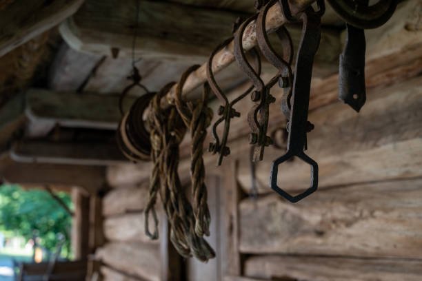 old simple tools outside an antique stable in the countryside