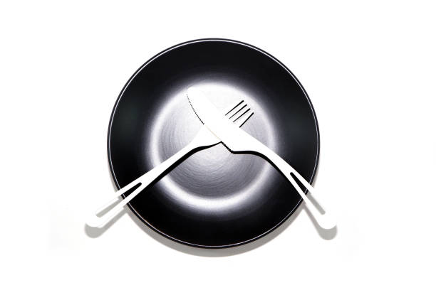 istock Empty plate with cutlery set isolated on white background close-up top down view 2162964089