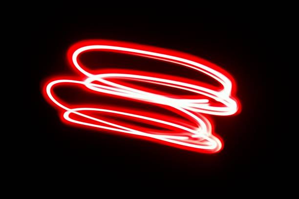 istock Blurred red neon lights.  Overlay of colored light.  Disco lighting.  Soft texture of unfocused red ultraviolet light on dark abstract empty space background 2162964304