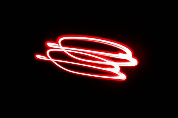 istock Blurred red neon lights.  Overlay of colored light.  Disco lighting.  Soft texture of unfocused red ultraviolet light on dark abstract empty space background 2162964308
