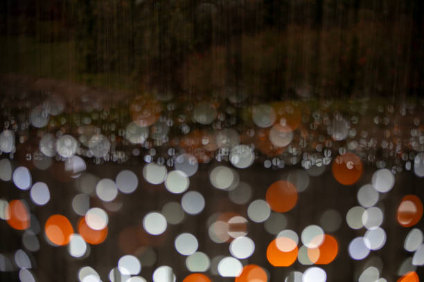 white and orange sparkle glitter on dark background and copy space for your design