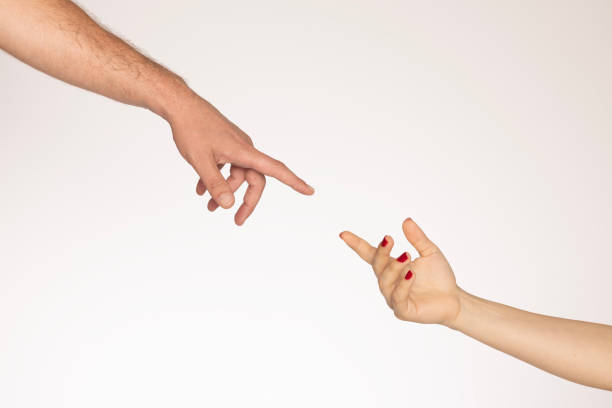 istock Hands of two people reaching for each other 2162965794