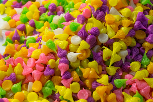 istock Vibrant Multicolor Candy Sprinkles or Confetti on Textured Backdrop with Concept 2162966953