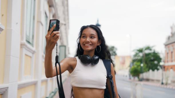 istock Woman holding a camera vlog 2162967561
