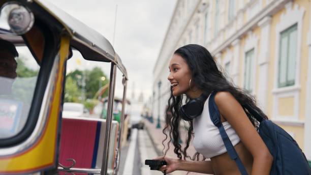 istock Woman using tuk tuk service 2162967566
