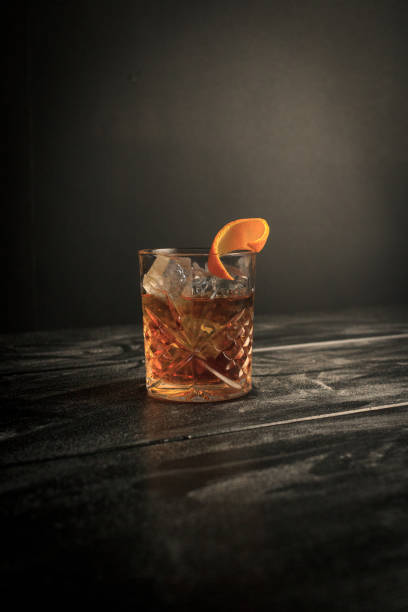 istock Old Fashioned Cocktail in Black Background Orange Zest 2162967901