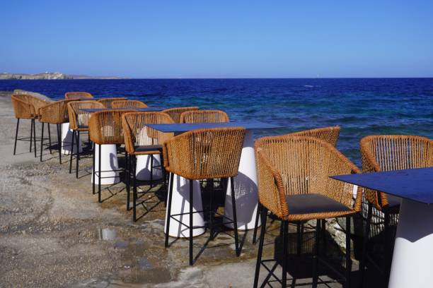 istock Empty Tables and Chairs by the Aegean Sea 2162968570