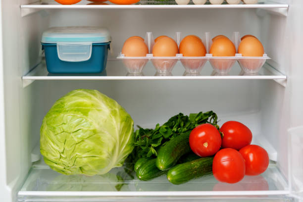 istock Well-Stocked Refrigerator With Fresh Produce, Eggs, and Other Groceries 2162968597