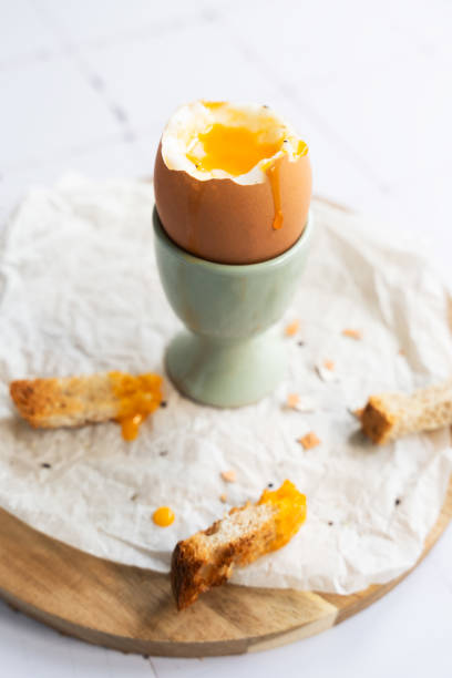 istock Soft boiled egg with liquid yolk on egg cup. Protein food. 2162969592