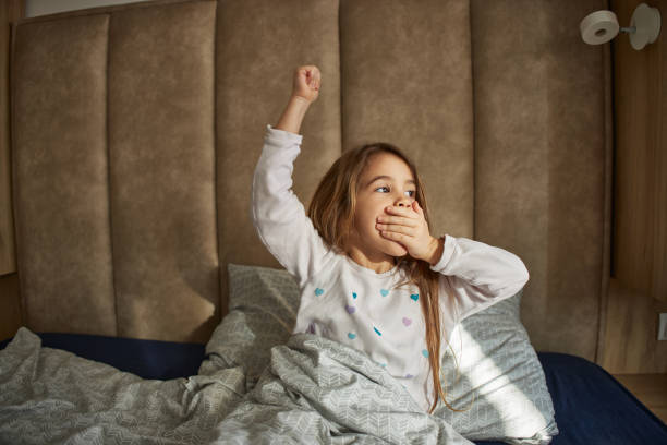 istock Adorable little girl waking up 2162969751