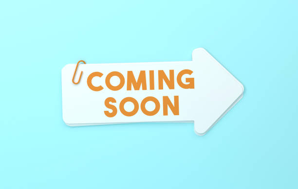 Coming Soon Written Arrow Shaped Sticky Notes On Blue Background. Direction Concept.