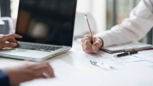istock Architecture drawing on architectural project business architecture building construction Colleagues designer Planning Design on blueprint and compasses 2162972698