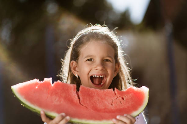 istock Beautiful girl eating watermelon 2162972924
