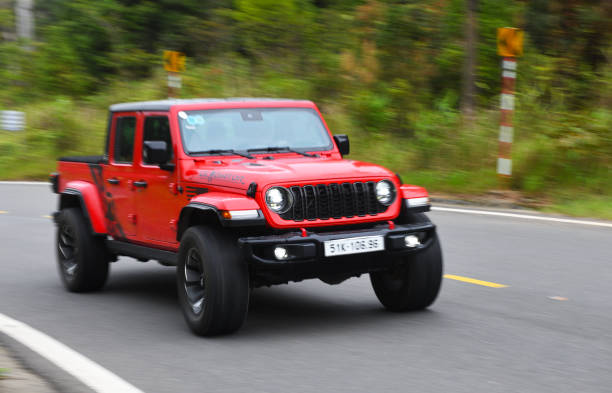 Vietnam Danang 24.06.2024:Jeep Gladiator, 2020  on the road in the mountains.