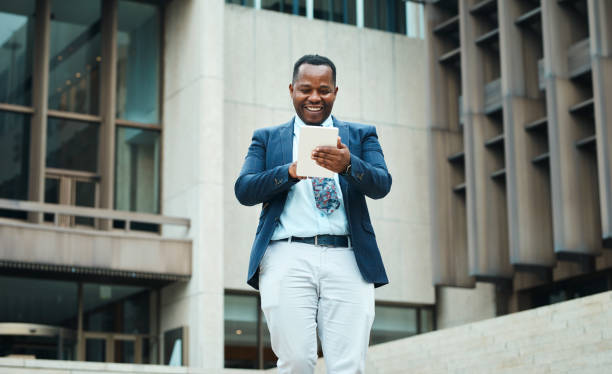 istock Confident Black Businessman Using Tablet in the City 2162976080