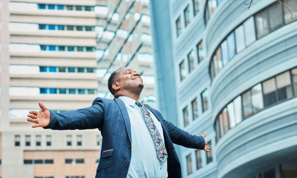 istock Confident Businessman Embracing Success Amidst Modern Cityscape 2162976238