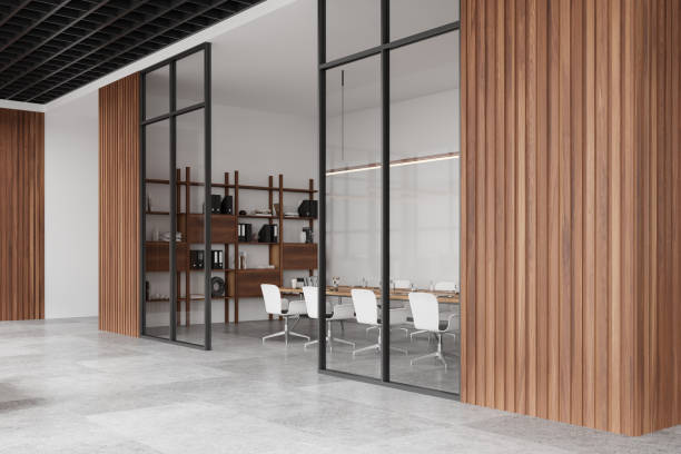 istock Stylish glass meeting room interior with board and chairs, shelf with documents 2162977219