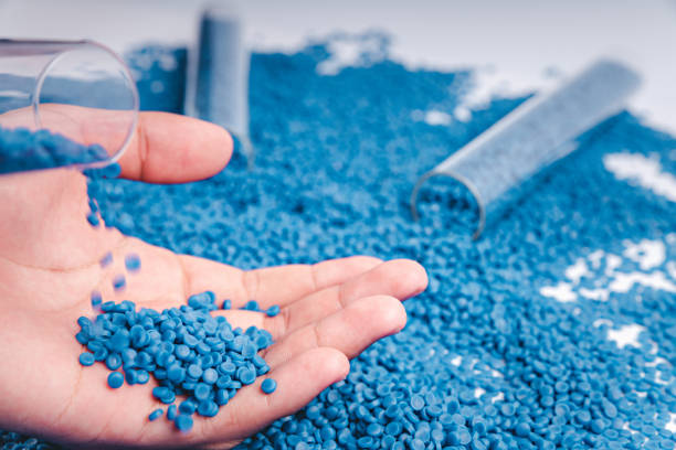 istock Blue plastic grain, plastic polymer granules,hand hold Polymer pellets, Raw materials for making water pipes, Plastics from petrochemicals and compound extrusion, resin from plant polyethylene. 2162977516