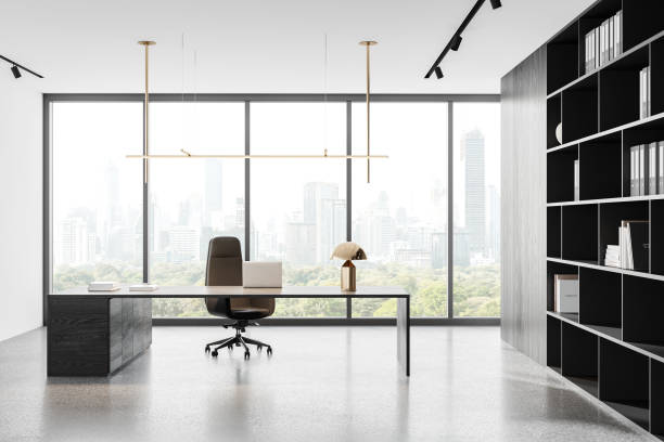 istock Office interior with ceo desk near panoramic window, laptop and shelf 2162978758