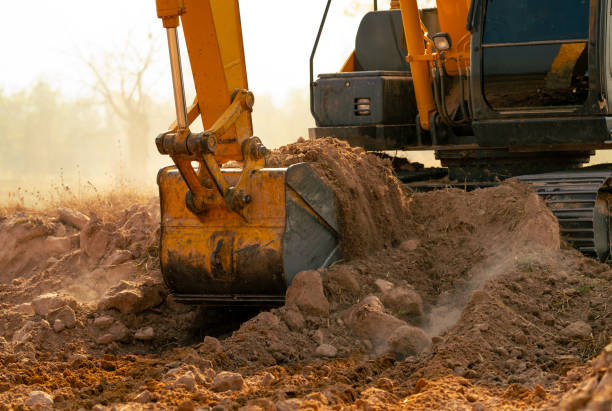 istock Backhoe working by digging soil at construction site. Crawler excavator digging on demolition site. Excavating machine. Earth moving machine. Excavation vehicle. Construction business. 2162978883