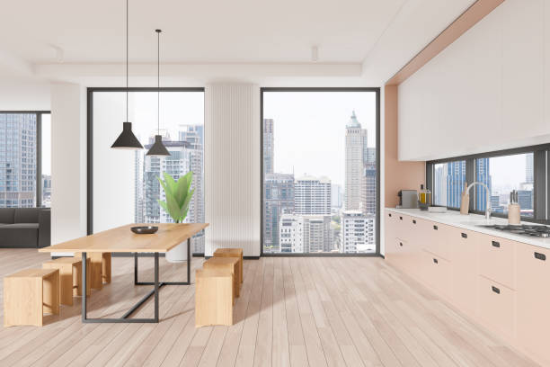 istock Stylish home interior with cooking and relaxing space with couch and window 2162979022