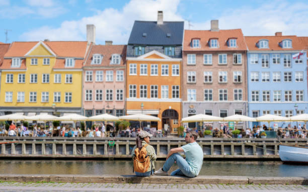 istock Couple Relaxing by Copenhagen Canal 2162979245