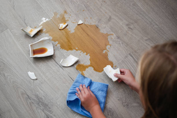 istock A broken cup of coffee fell on laminate, coffee spilled on floor. 2162979689