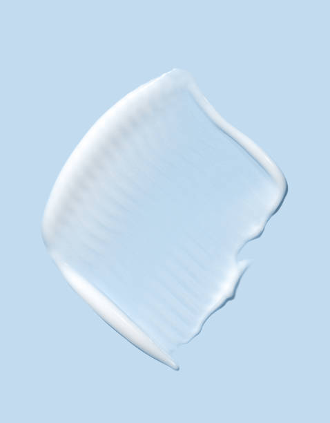 istock cosmetic smear cream texture on blue background 2162980915