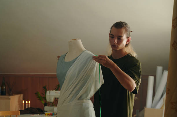 istock Tailor Measuring Clothing On Mannequin 2162981165