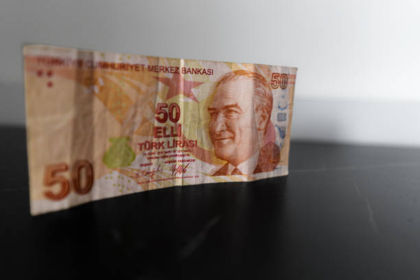 istock 50 turk liras bank note on a table 2162990151