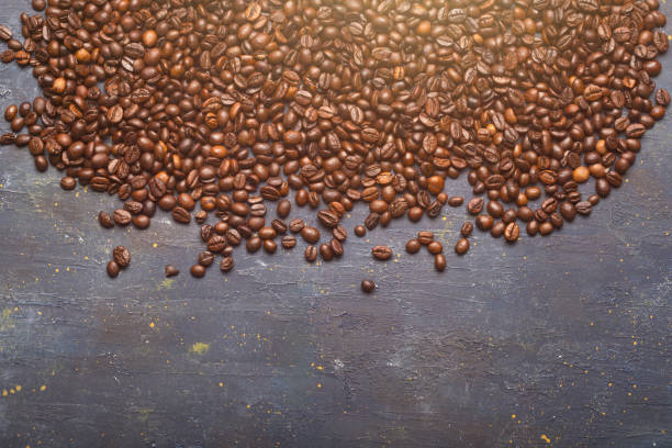 istock Roasted coffee beans on rustic slate, space for copying 2162991033