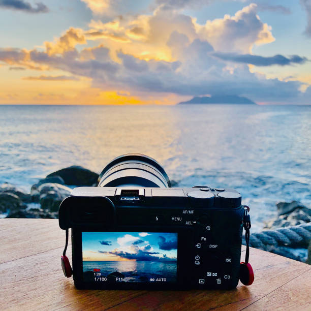 istock Camera capturing stunning sunset over ocean with dramatic clouds and distant island 2162991647