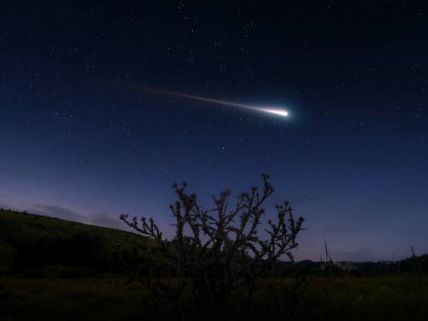istock Shooting star in the sky. Evening landscape with a meteor. 2162994339