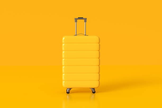 istock Yellow suitcase standing on yellow background minimal concept travel 2162994509