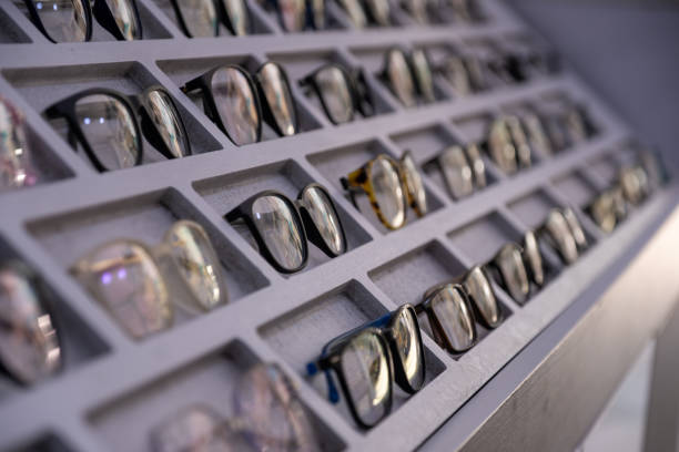 medical eyeglasses are presented on shelf for selling with light reflection on it is lens