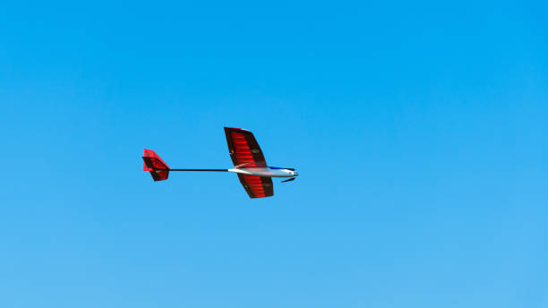 istock Aerobatic glider flying, clear blue sky 2162998678
