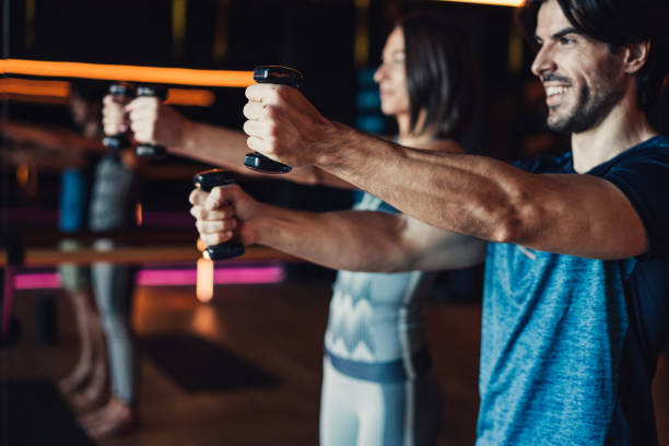 istock Couple exercising together in a gym. 2162998815