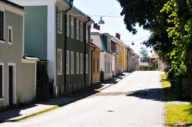 istock A empty street among buildings during summer 2162999937