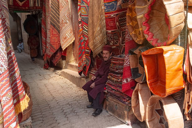 Vibrant Traditions: Moroccan Carpets in Fes Medina stock photo
