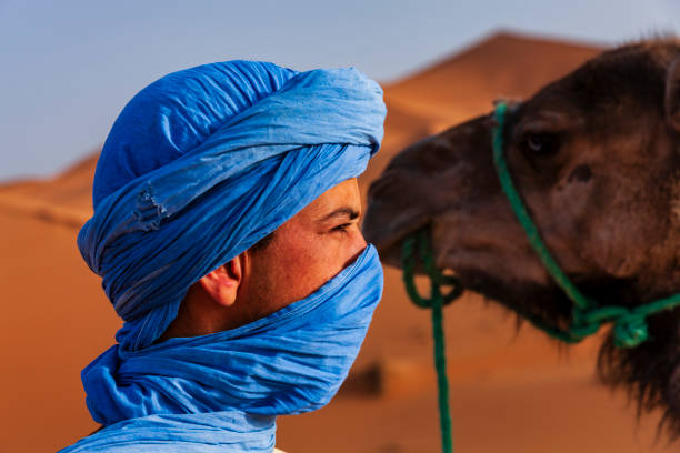 istock Young Tuareg with camel on Western Sahara Desert in Africa 2163000607