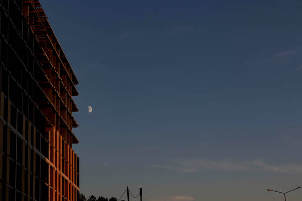 The moon and the building under construction, taken in the evening