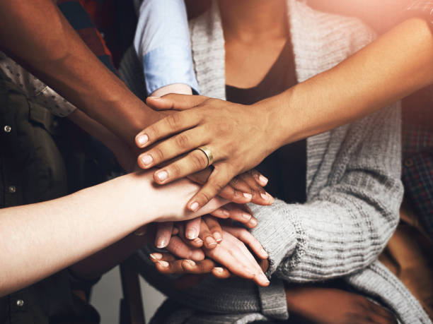 istock Hands, stack and group in circle with support, solidarity and connection for synergy with people. Teamwork, link and care with scrum, huddle and helping with collaboration, community and agreement 2163001564